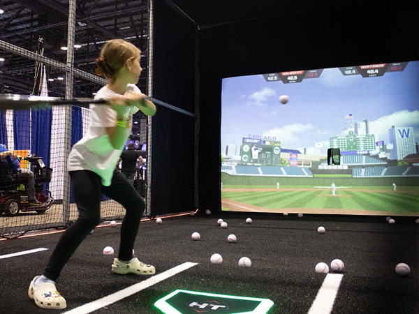 Simulated field baseball pitching machine